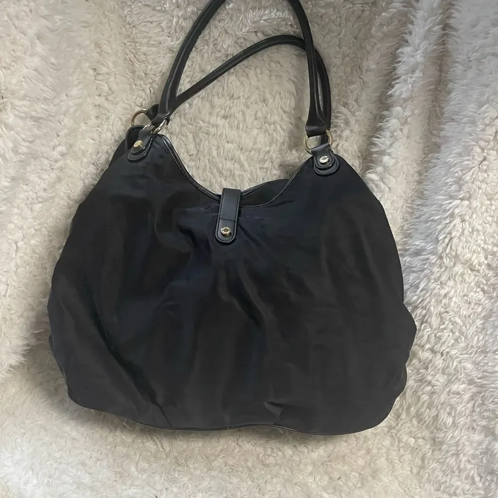 Calvin Klein Black Nylon large shoulder bag with gold tone hardwares.